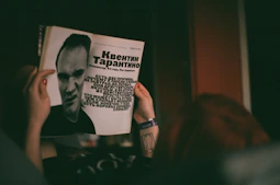 Dominique's photograph displayed in a glossy magazine article about Atlanta's street life.