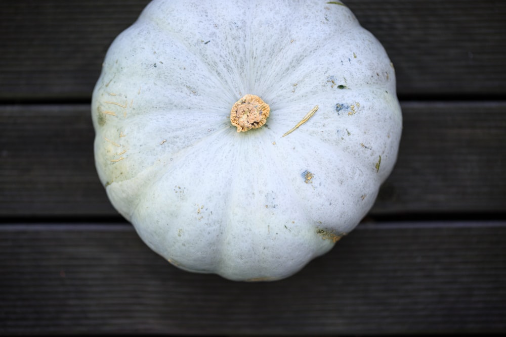 pumpkin on brown wooden surface