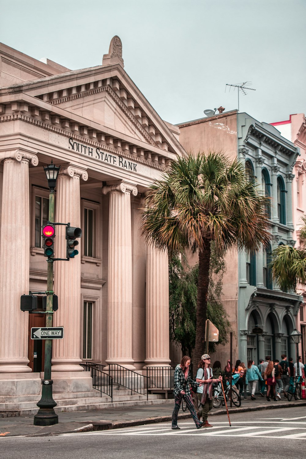 people walking in front of South State Bank