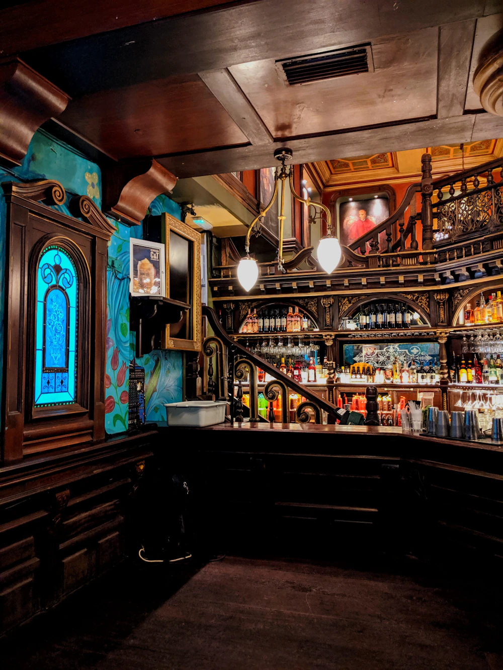 Home Bar Counter Design Ideas: Hanging Stemware Racks, Onyx Backsplash & Ambient Lighting
