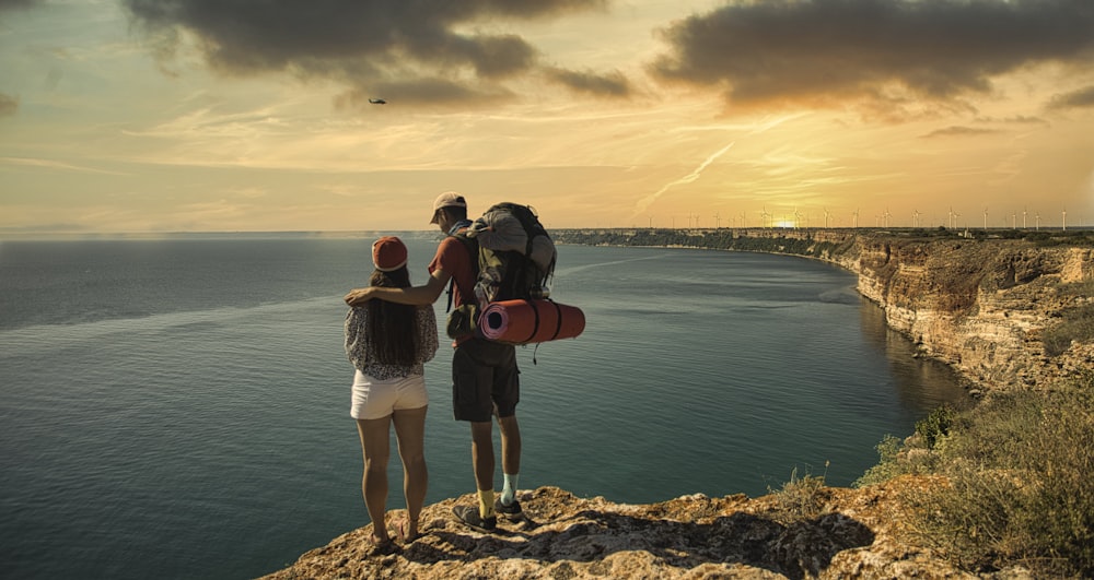 couple standing on the mountain cliff