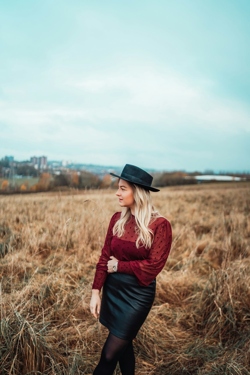 shallow focus photo of woman in maroon long-sleeved shirt