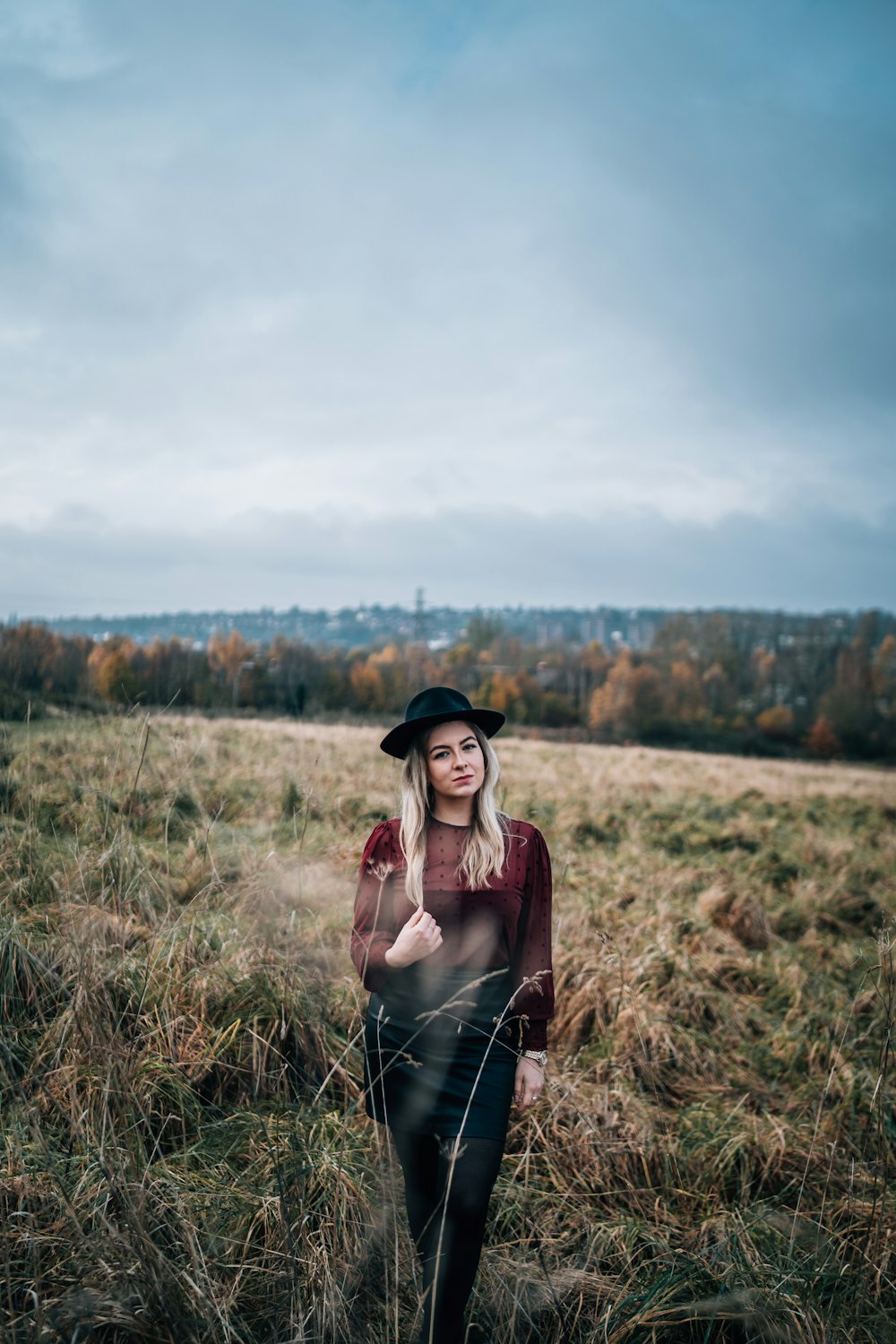 woman walking on grass during day