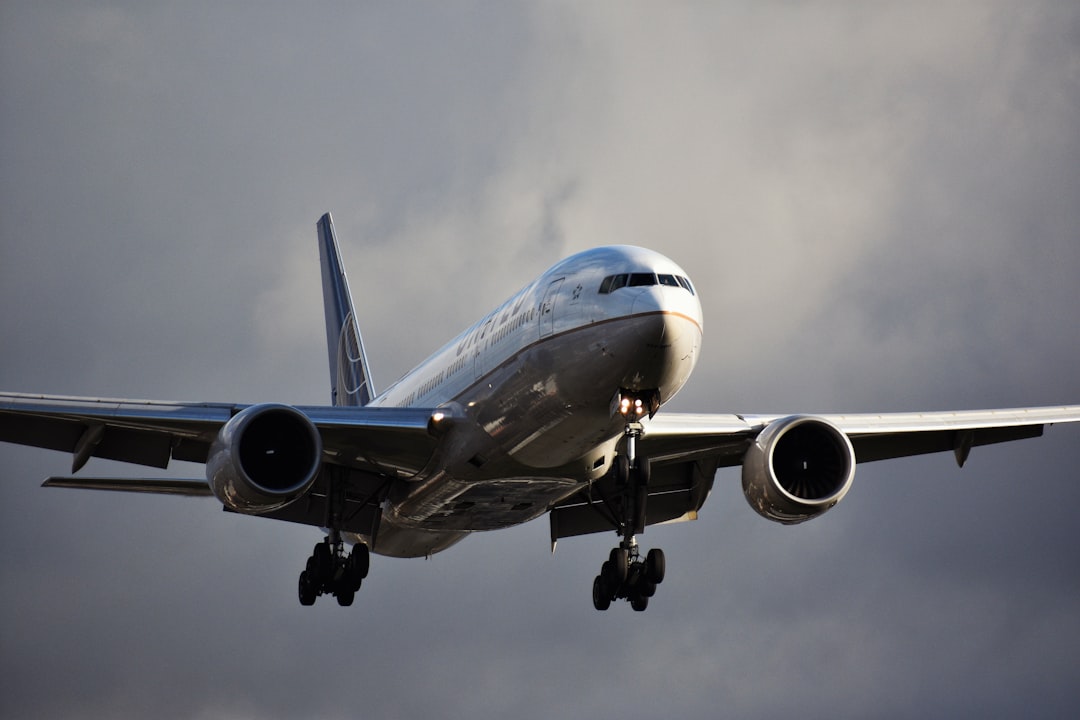 gray airplane in mid air,