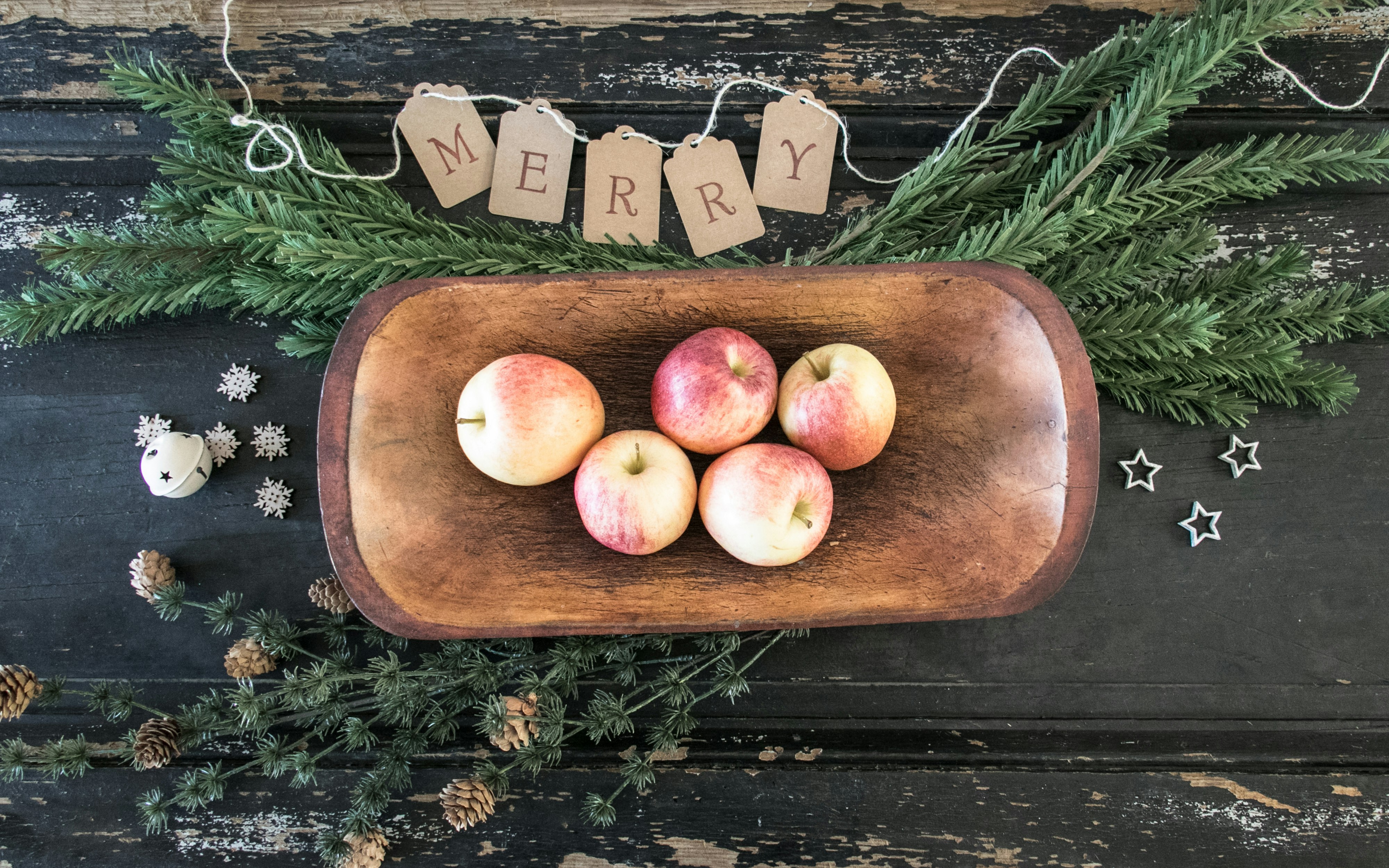 five apples on brown wooden tray