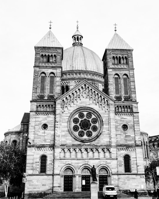 grayscale photography of a dome cathedral in Catholic Church Saint-Pierre-le-Jeune France