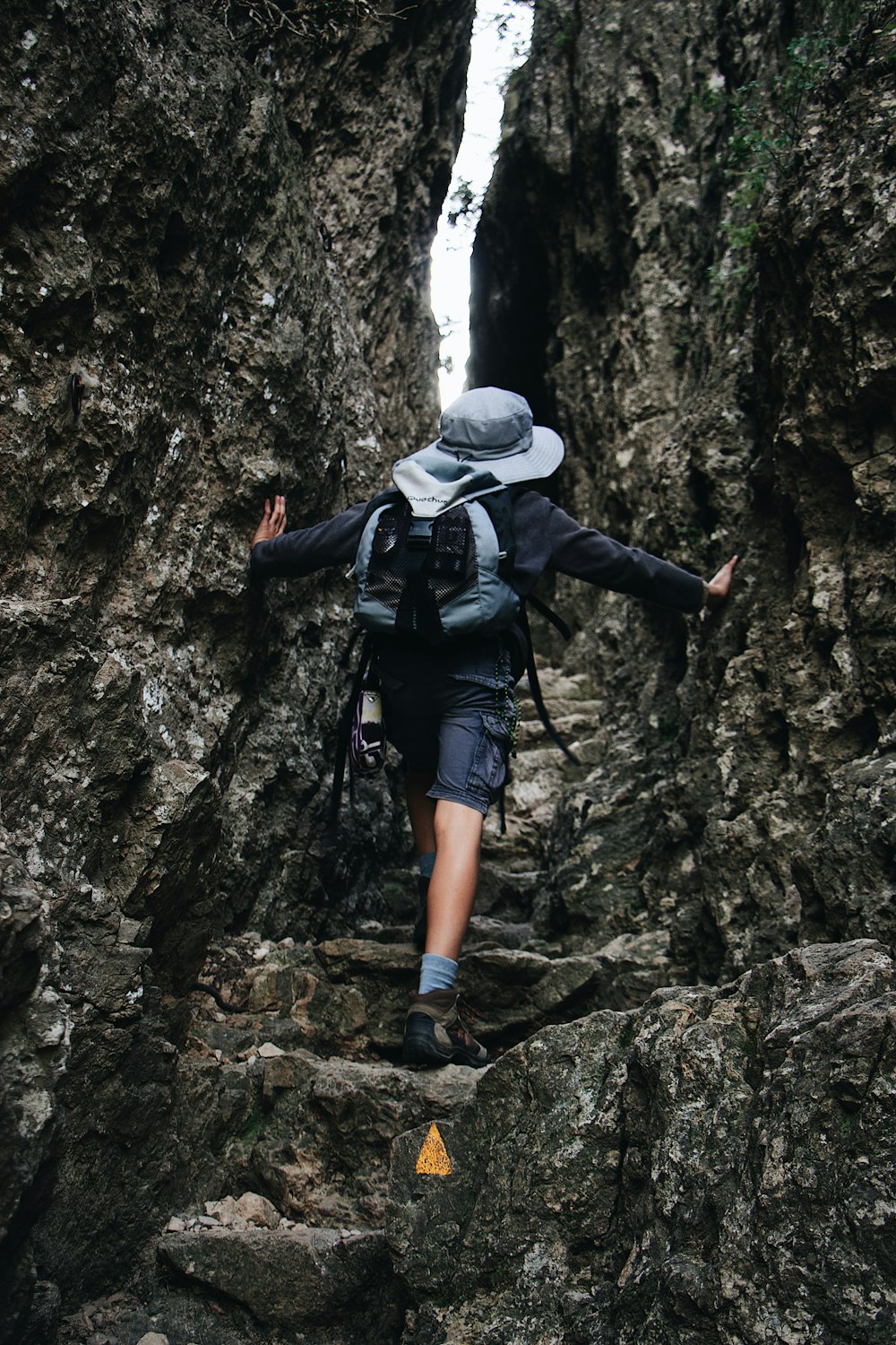 man wearing grey hiking hat