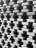 A close-up of bricks being stacked for a wall.
