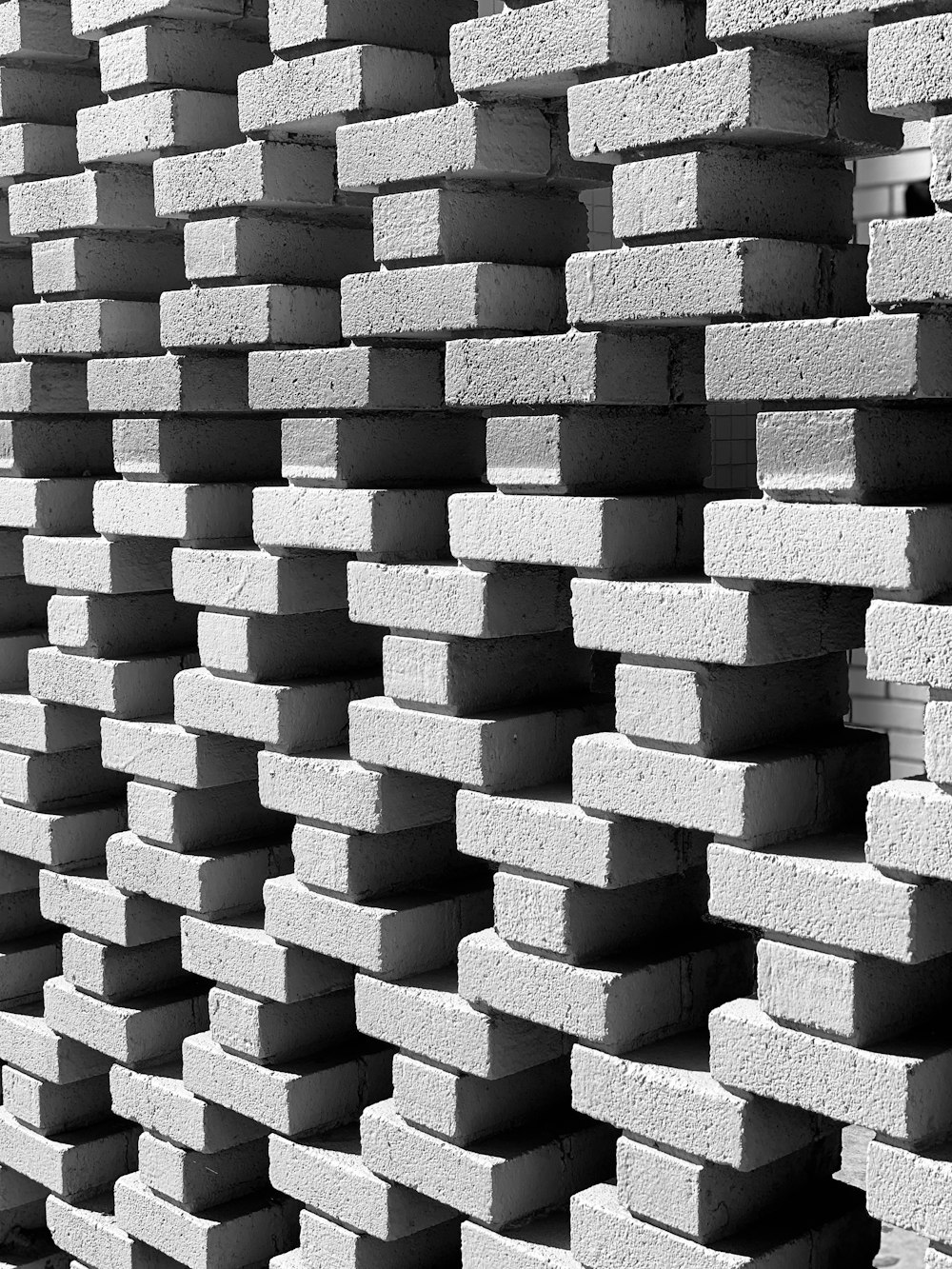 black and white photograph of a stack of bricks