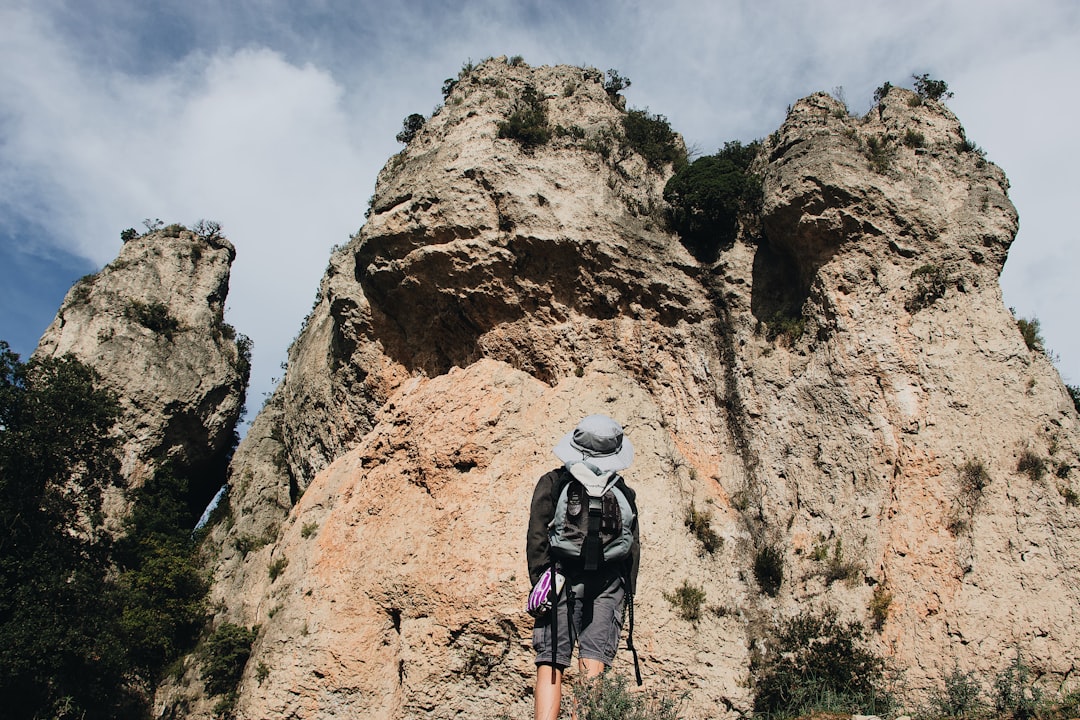 person standing near mountain during daytime