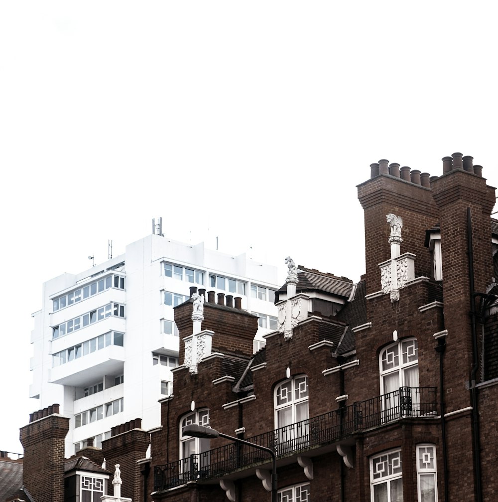 brown and white concrete buildings under white sky during daytime