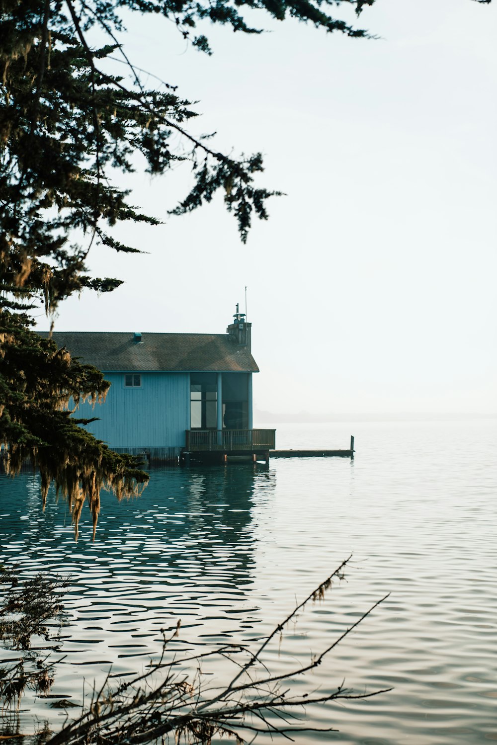 white and gray concrete house by the sea