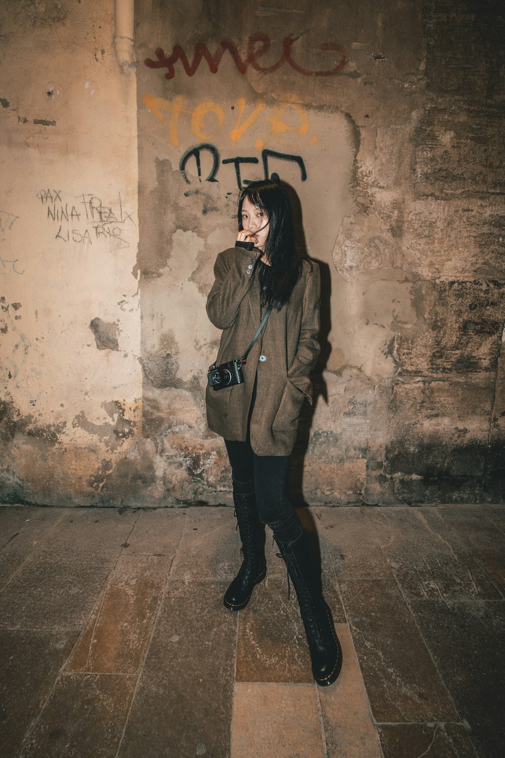 woman standing against wall