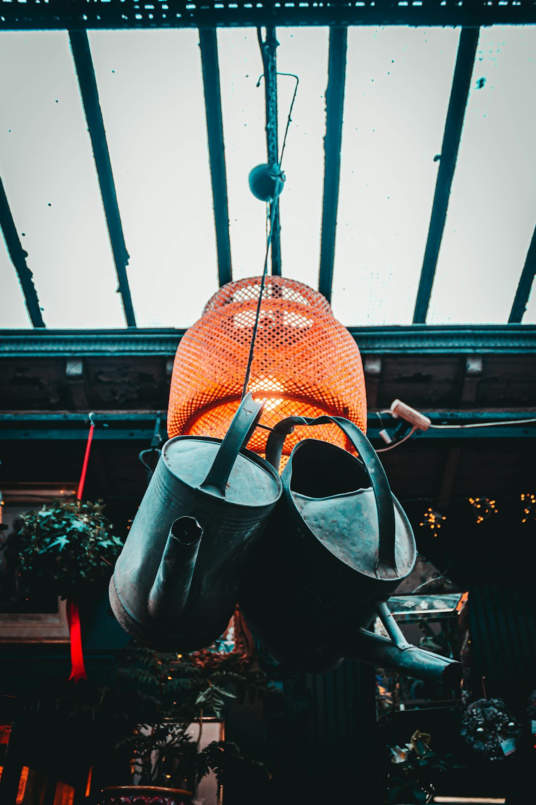two hanged black watering cans screenshot