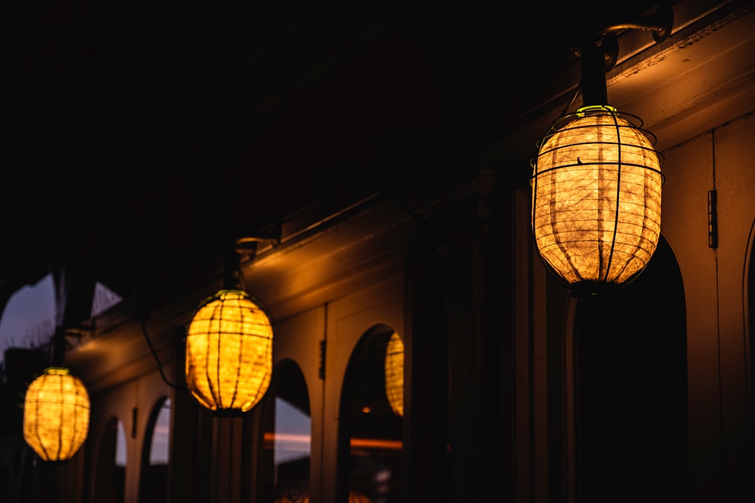 lightened lanterns in front of buildings