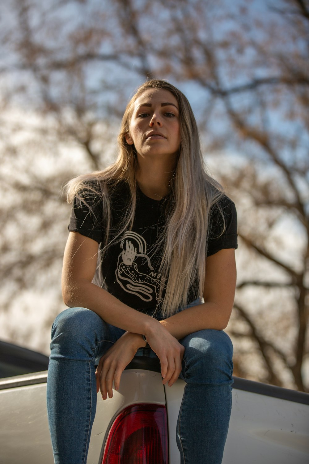 woman sitting on truck bed