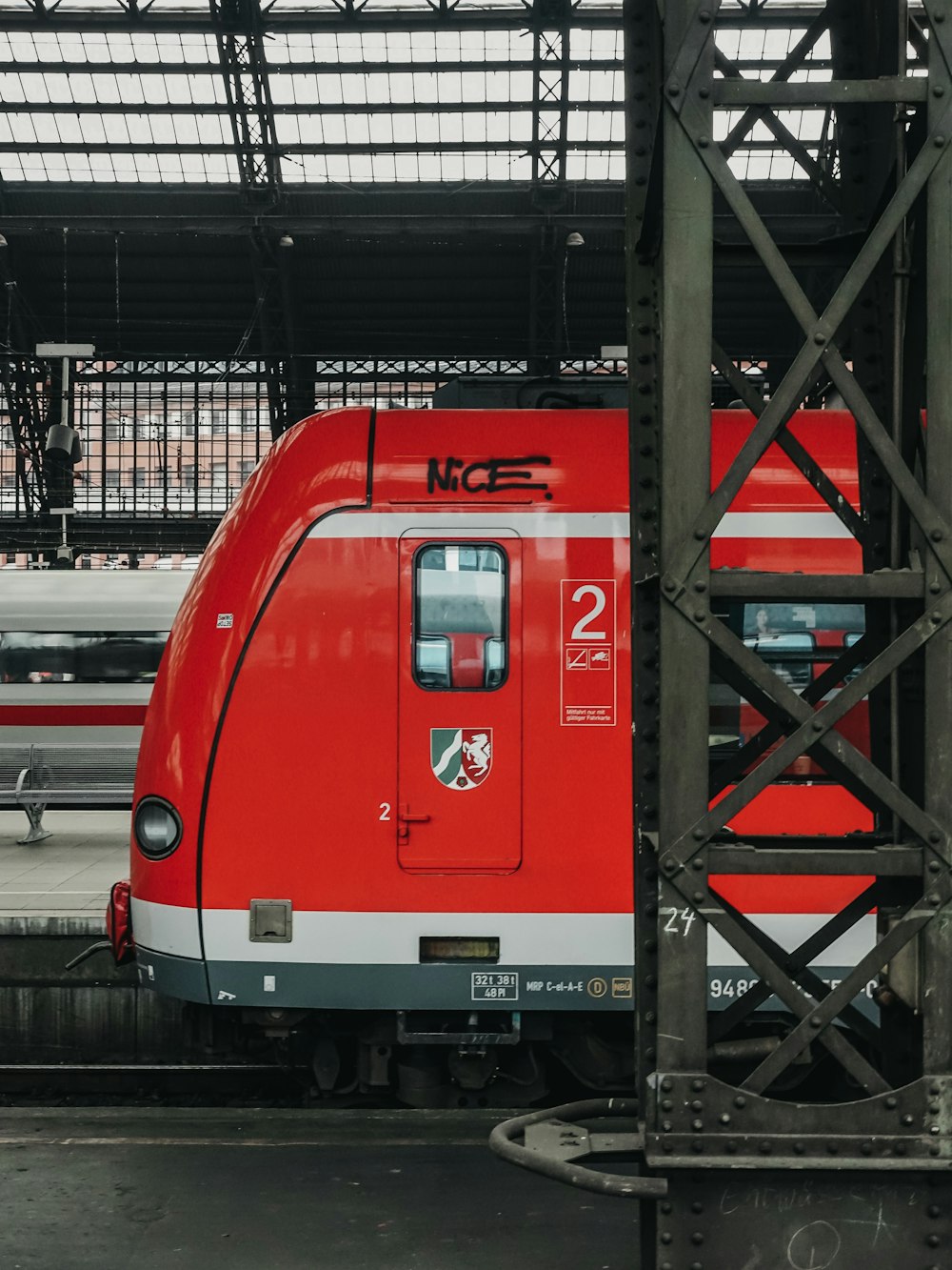 red and white train in station