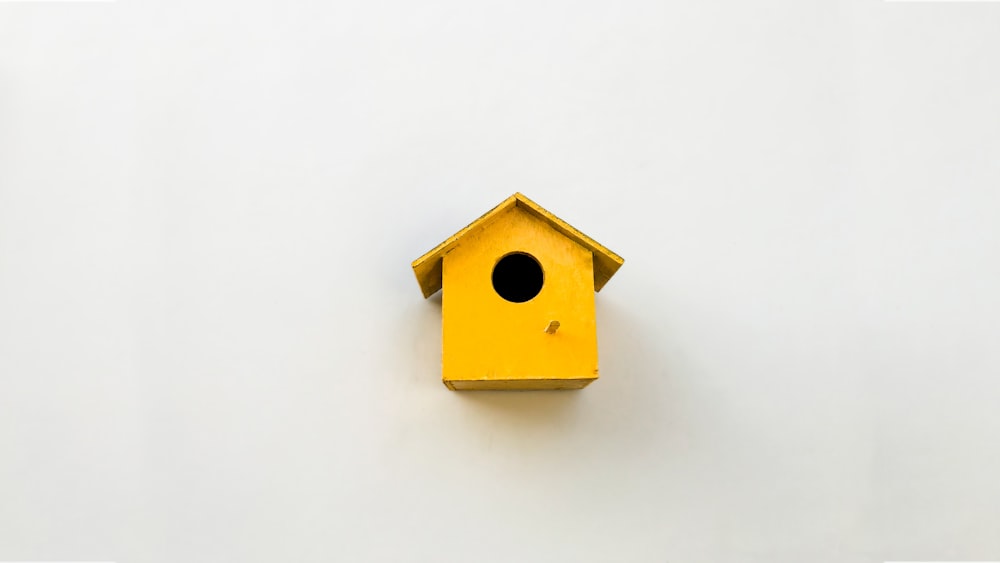 yellow bird house illustration