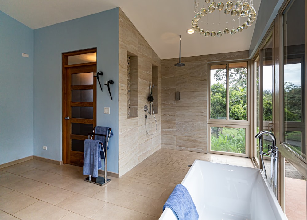 white ceramic bathtub inside room