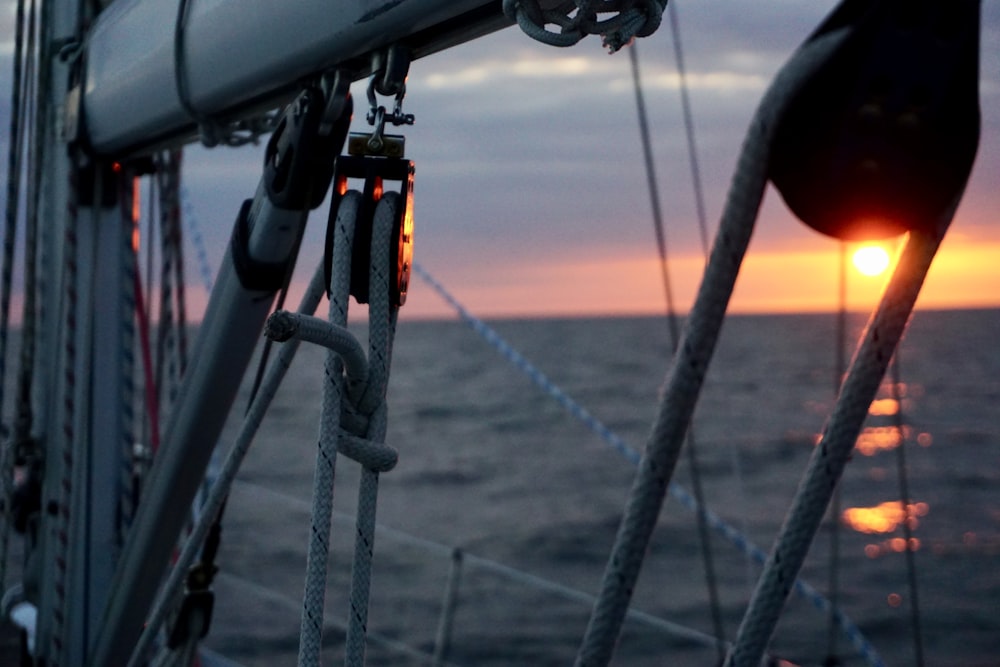 sunset through boat ropes