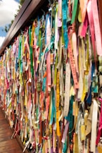 a wall covered in ribbons of different colors