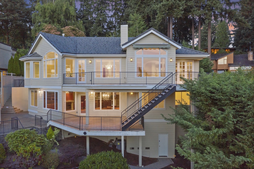 white and gray concrete 2-story house during daytime