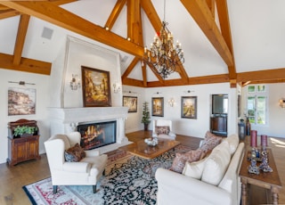 sofa set, coffee tablem and elctric fireplace in white and brown living room