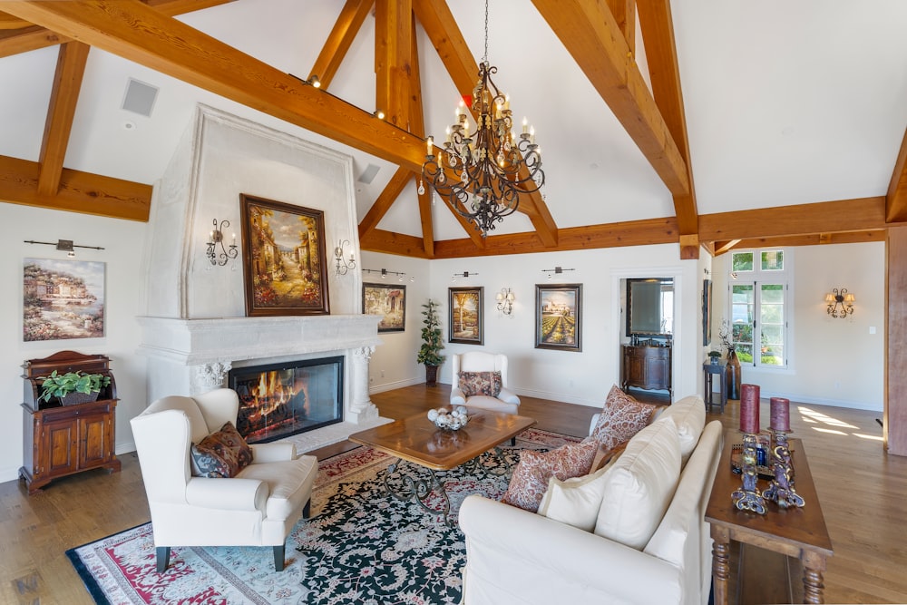 sofa set, coffee tablem and elctric fireplace in white and brown living room