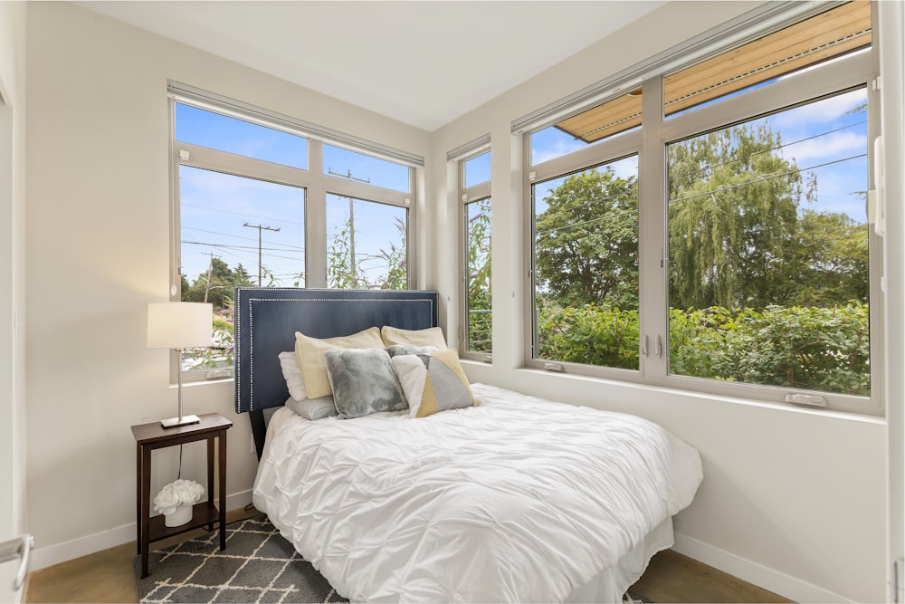 pillow on bed beside window