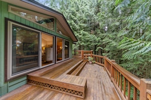 brown wooden terrace outside clear glass door