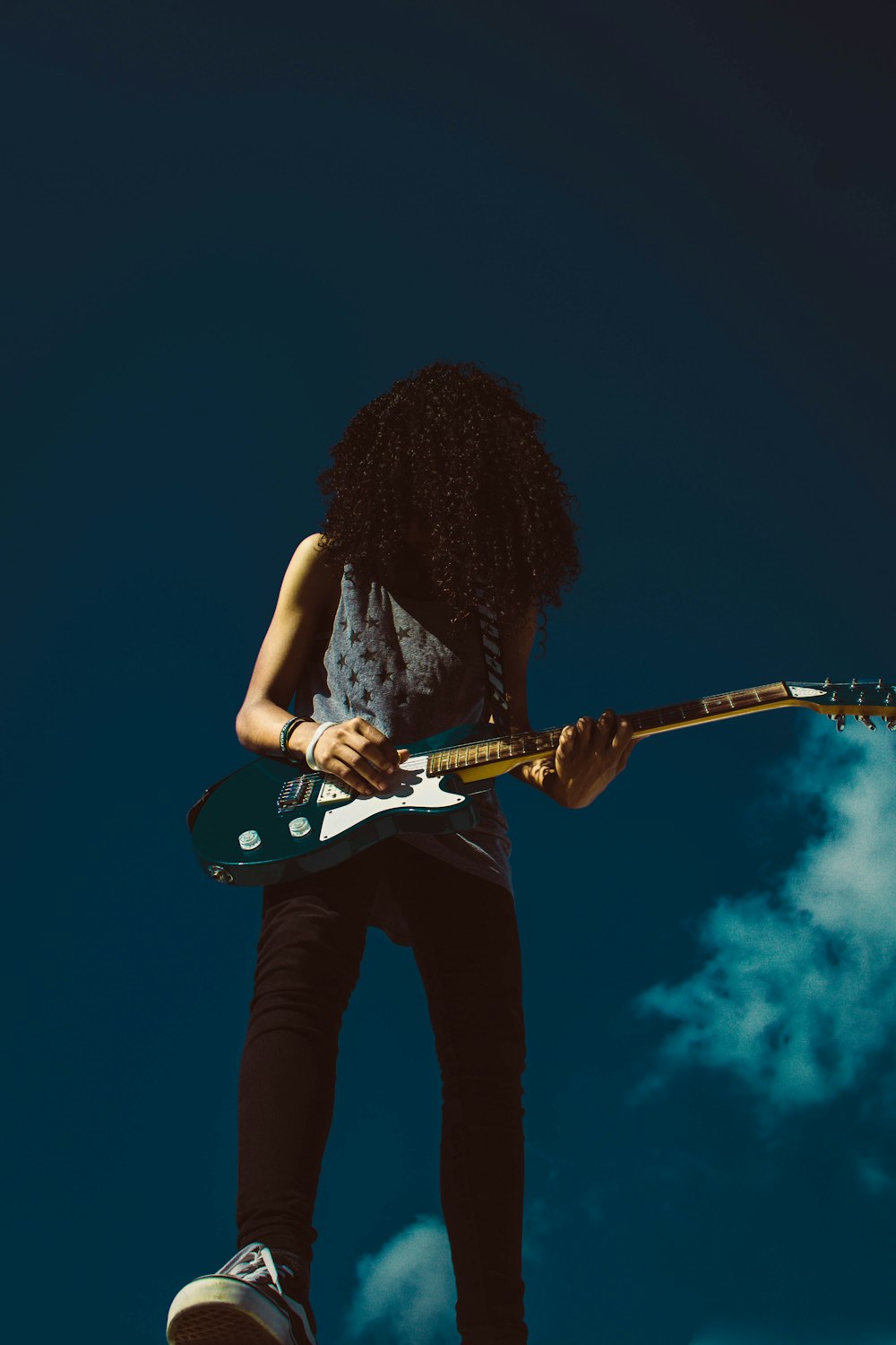 woman holding guitar