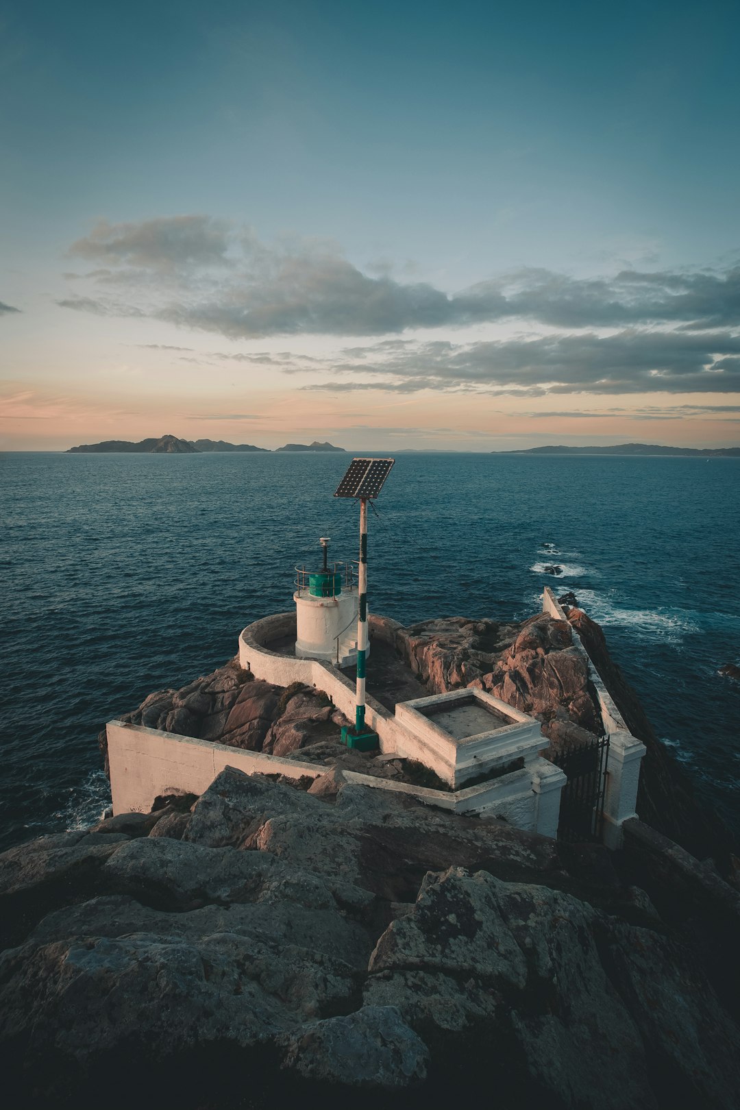 tower on cliff facing ocean