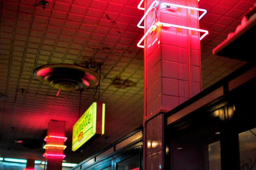 building with turned on lights and signage