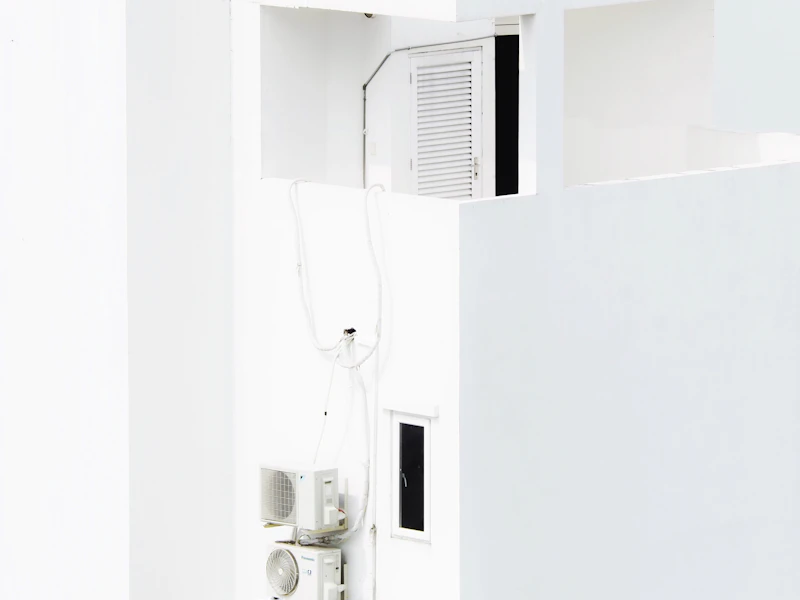 Wall mounted air conditioner in white room