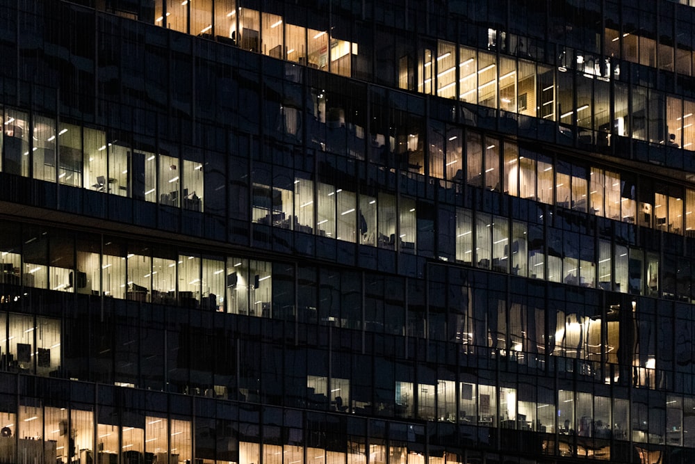 low angle photo of curtain glass wall building