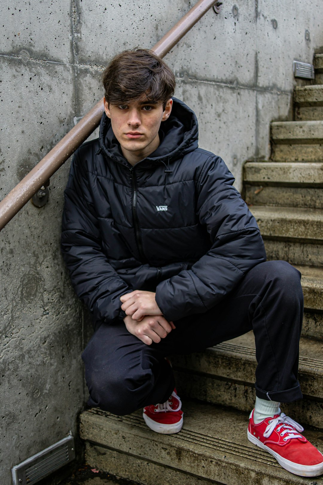 man sitting on staircase