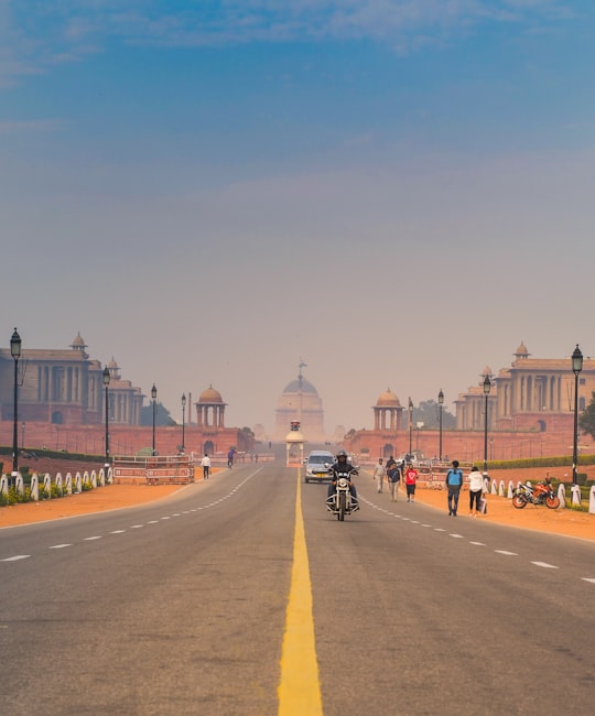 man riding motorcycle in India Gate India