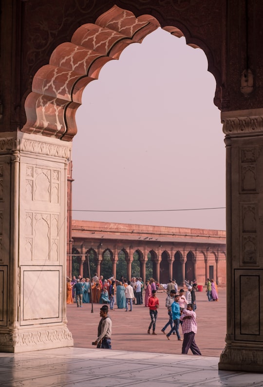 people walking near brown building in Jama Masjid India