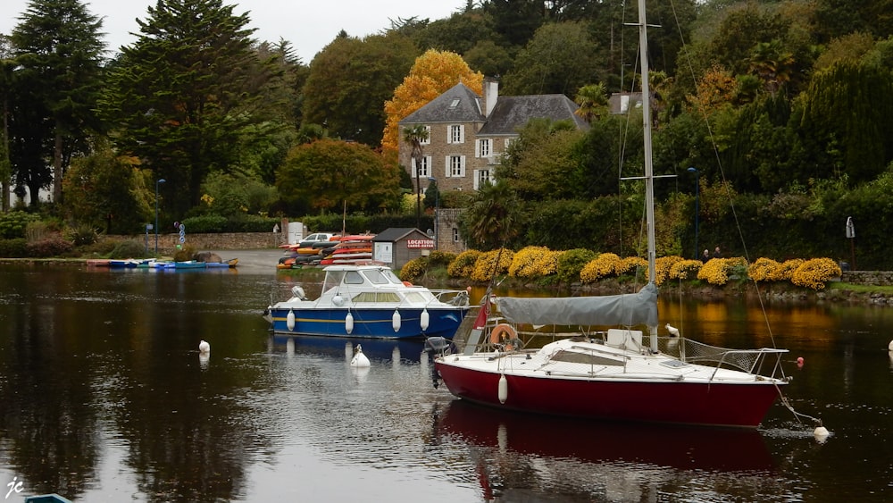 two white boats on lake