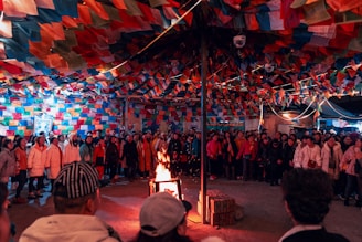 people gathered by bonfire