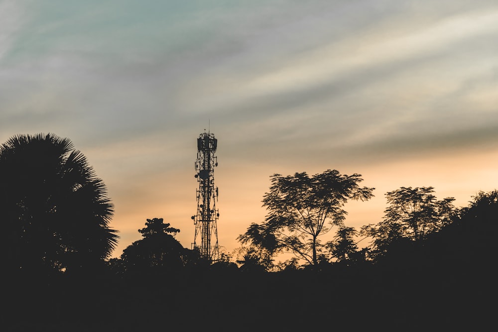 silhouette photography of tower during golden hour