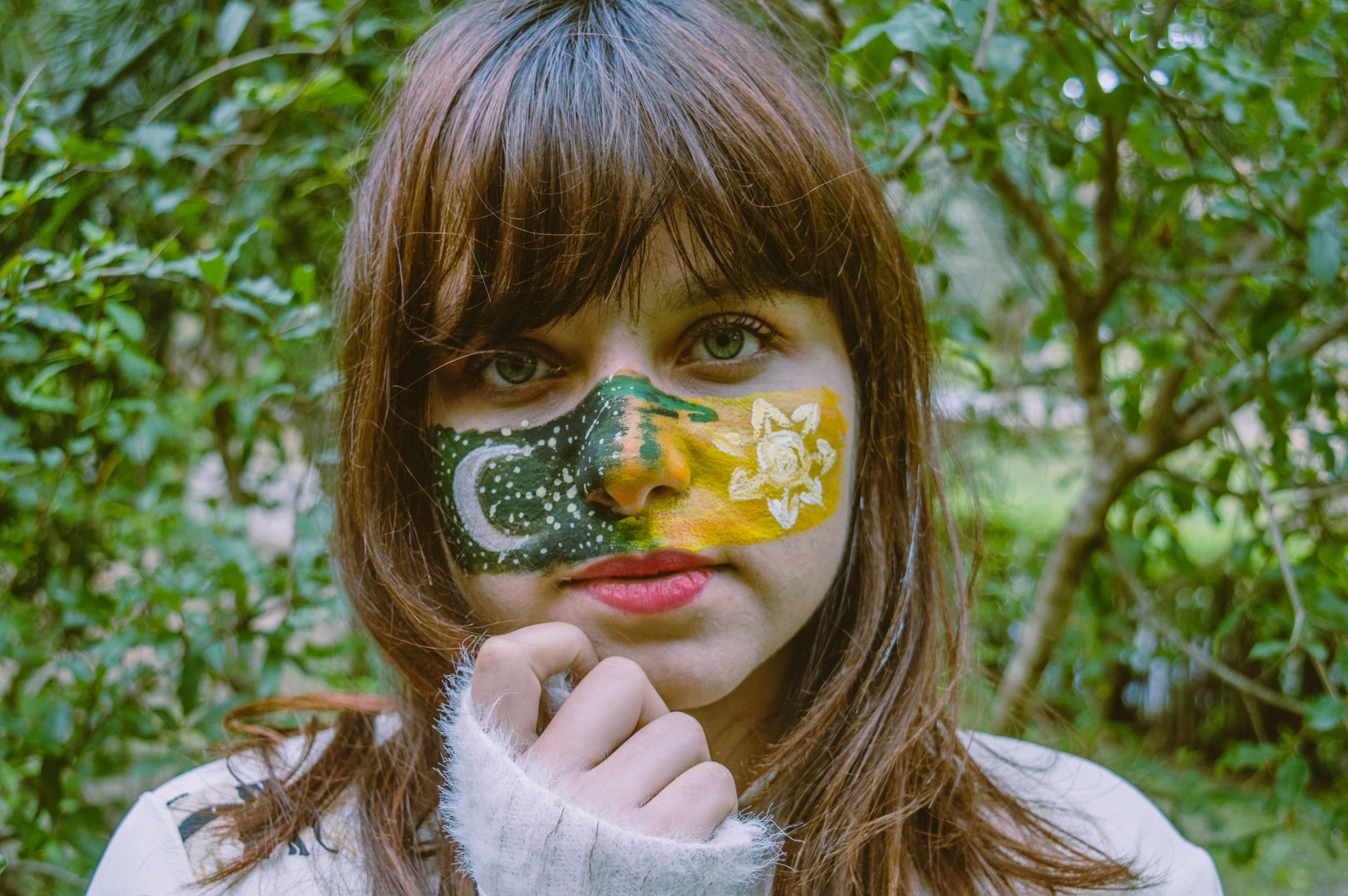 woman standing beside plants