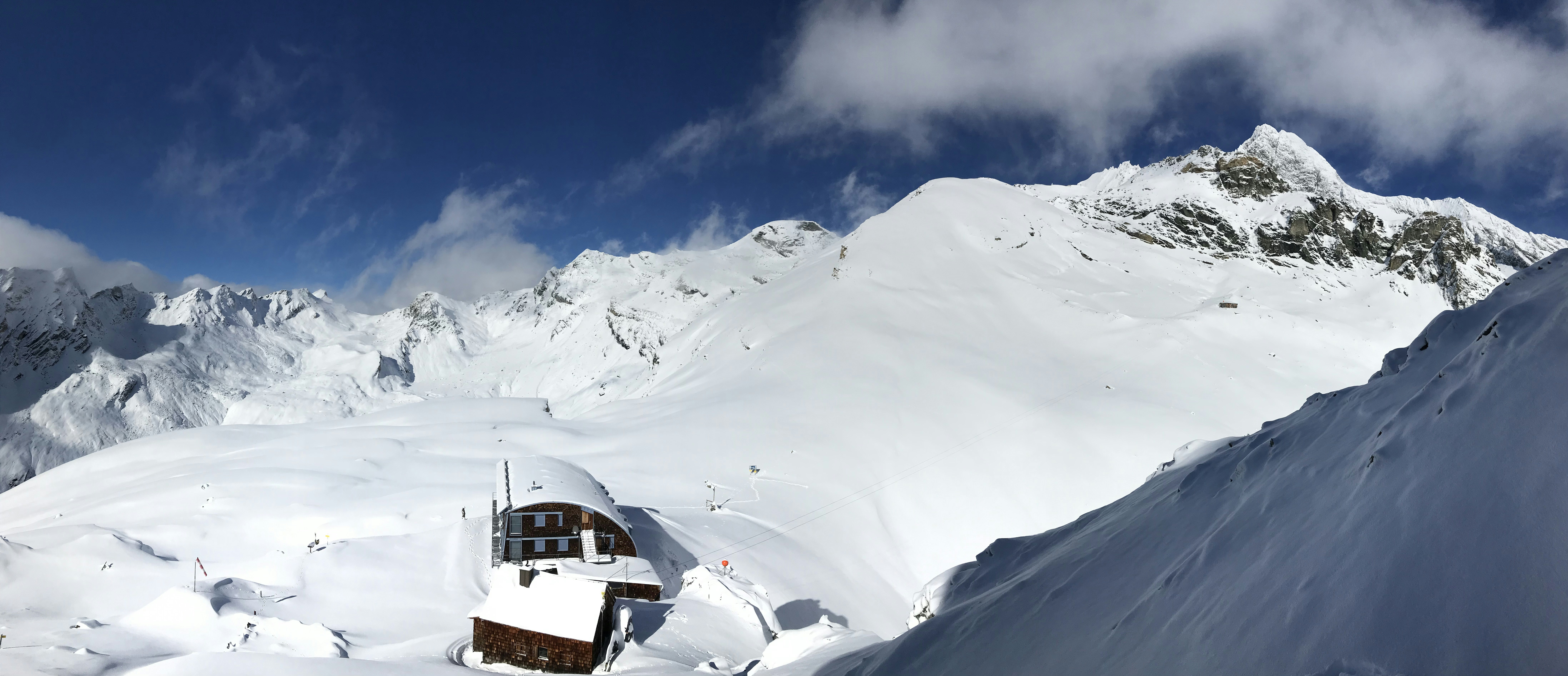cable car beside mountains, Beautiful Weather on a Hut in the High Mountains of the Alps