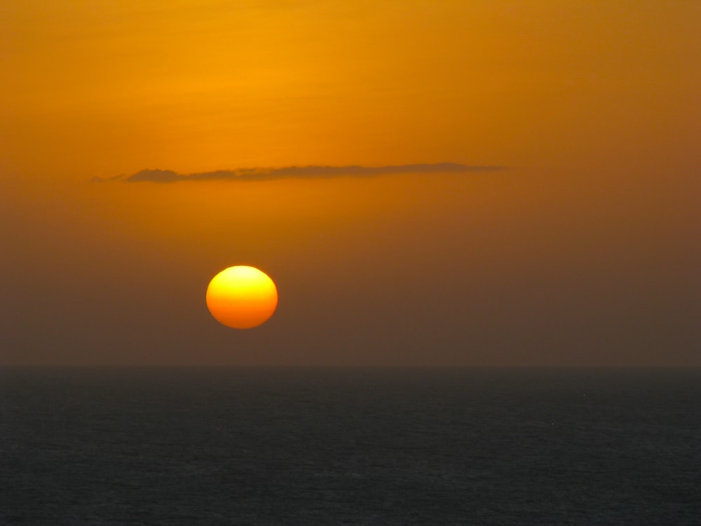 calm water of sea under golden hour