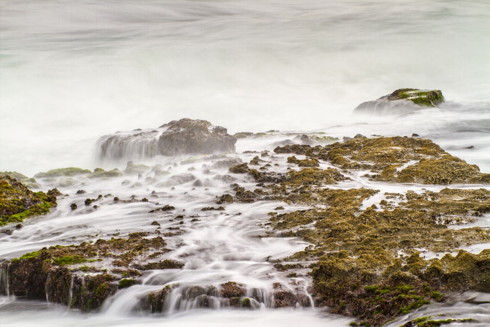 a large body of water surrounded by rocks