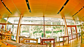 Cozy dining space with a large window offering natural light and lake view.