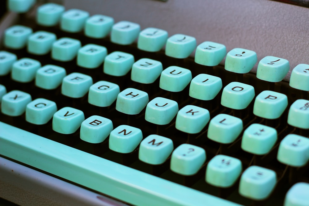 teal and black typewriter
