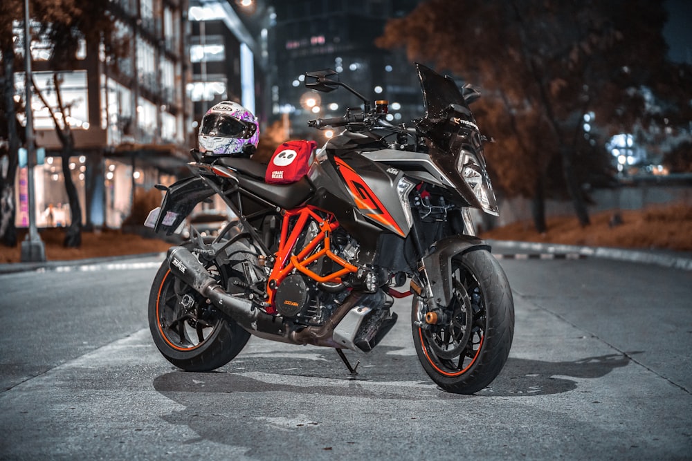 black and orange sports bike