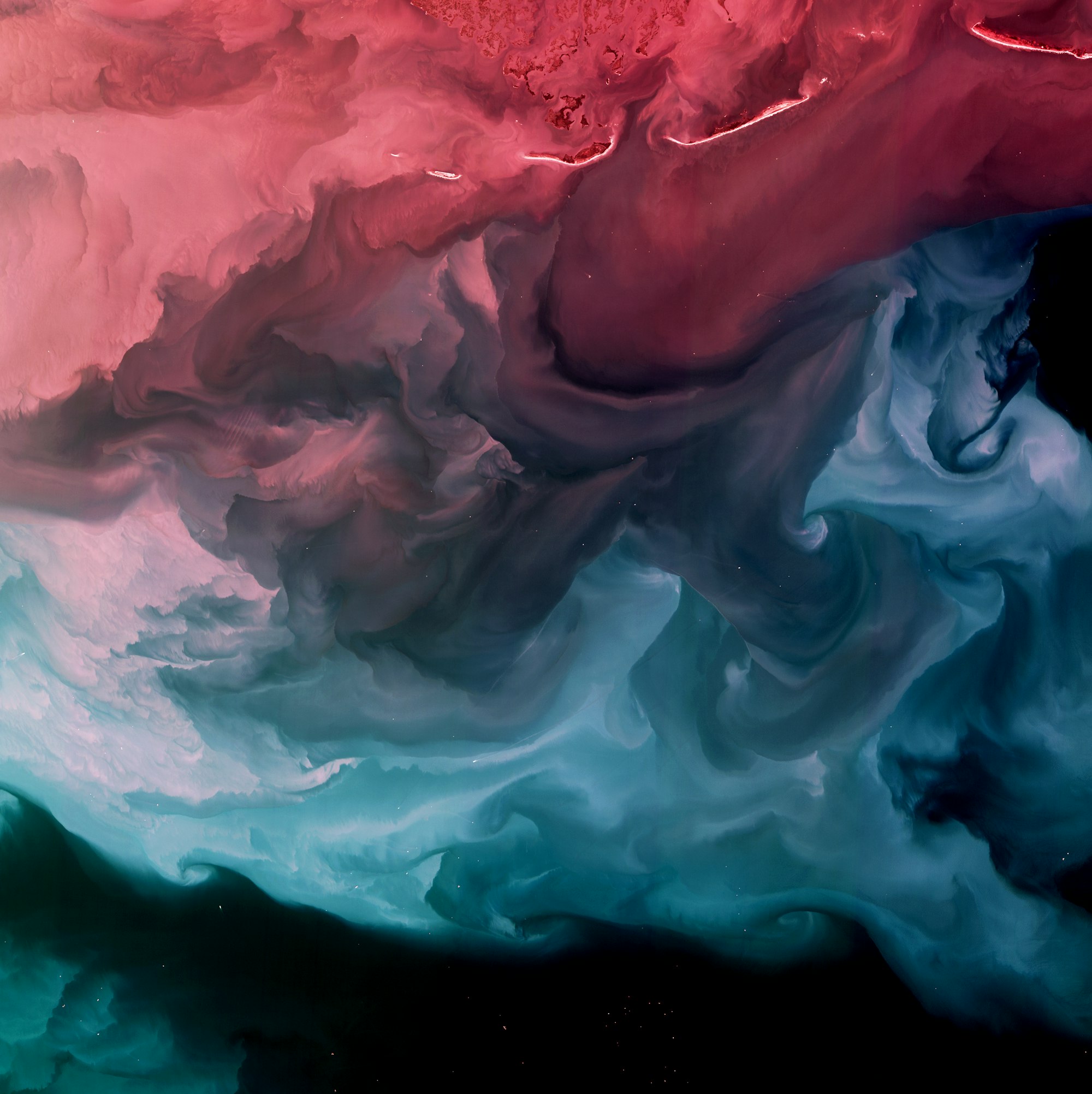 A serene gradient from red to smoky blue-gray seems to mask a chaotic scene underneath, expressing a wide range of emotion. Looking like a NASA closeup of Jupiter, this image reveals sediment in the Gulf of Mexico off the Louisiana coast.