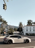white 5-door hatchback on concrete pavement